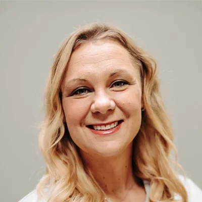 A headshot photo of DeAndra Herndon, a chiropractor at Generation Chiropractic